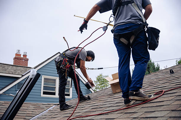 istock Engineers installing solar panels on home roof using safety equipment 2240169244
