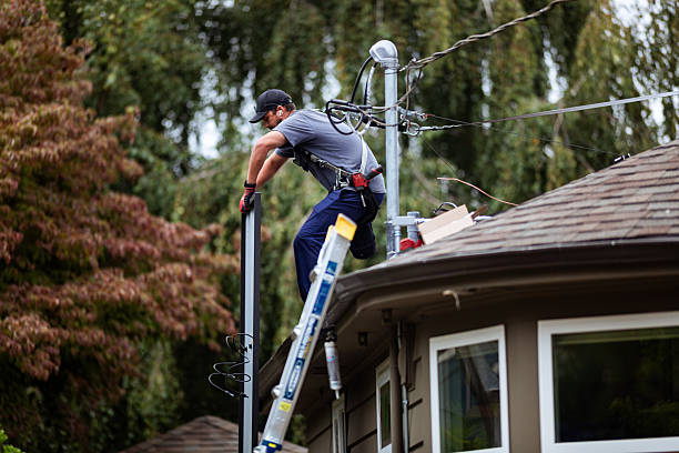 istock Professional Team of Engineer installing solar panels on home roof 2240169619