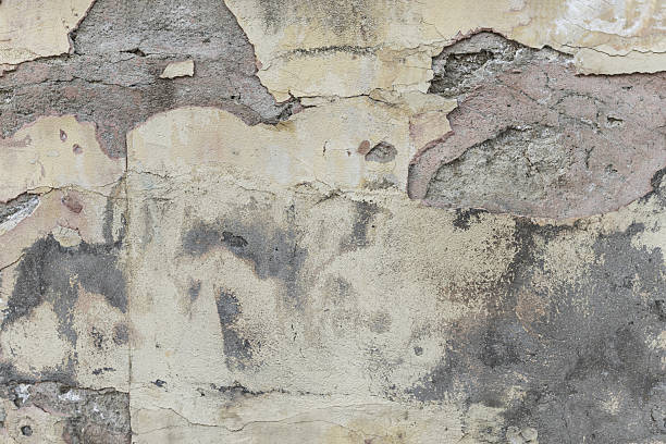 istock A wall in poor condition with cement stains on the paint and peeling pieces. Vector cement texture background 2240171905