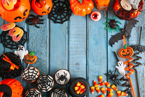istock Halloween party decorations frame on blue wooden rustic table 2240172188