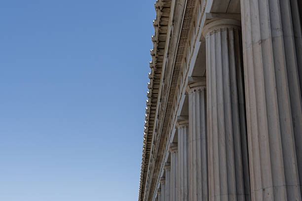 istock Ancient agora columns in athens, greece against blue sky 2240173173