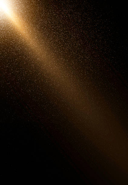 istock Golden light beam shining through dust particles 2240173199