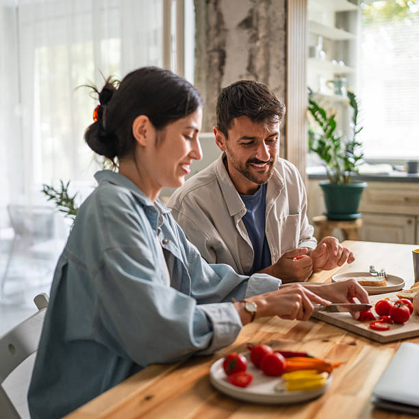 istock Couple cooking healthy breakfast in modern home kitchen 2240173324