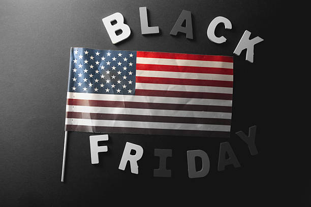 istock American flag and text BLACK FRIDAY on black background, top view 2240178409