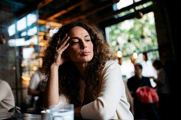 istock Woman pensive in cafe feeling thoughtful and melancholic 2240179681