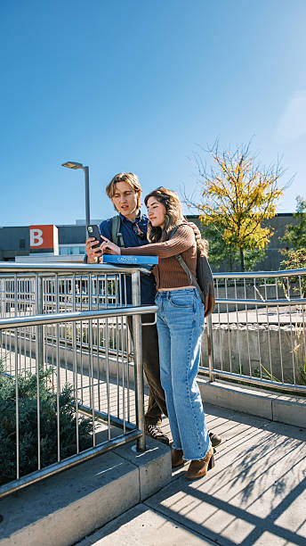 istock Young mixed race student couple  at the college exterior 2240179685
