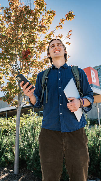 istock Young male student  at the college exterior 2240179744