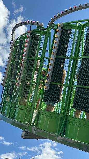 istock Closeup Spinning Carnival Ride Against Blue Sky 2240179984