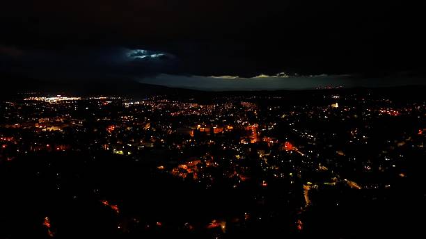 istock A Dramatic Night Cityscape Featuring Striking Lightning and Dazzling City Lights 2240185096