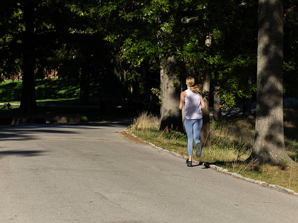istock Feamle jogger running for exercise and fitness 2240186375