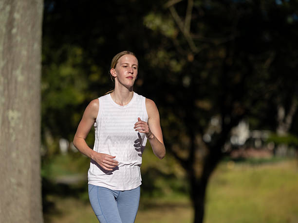 istock Feamle jogger running for exercise and fitness 2240186446