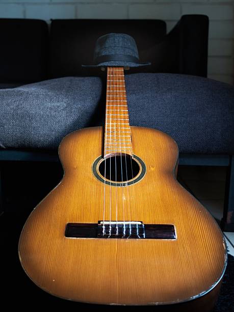 istock an acoustic guitar on the sofa 2240186675