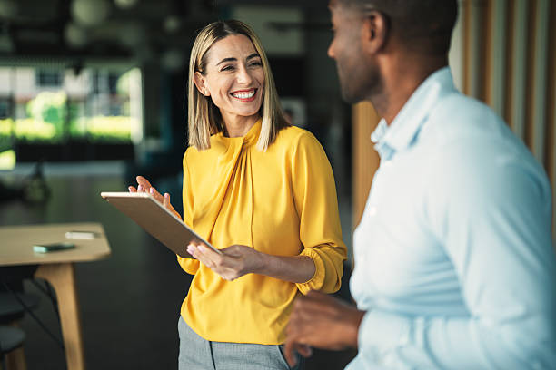 istock Business colleagues talking in the office 2240187671