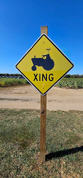 istock Whimsical Tractor Crossing Sign 2240194180