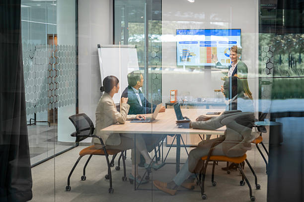 istock Business team analyzing sales data during meeting in modern office 2240196313