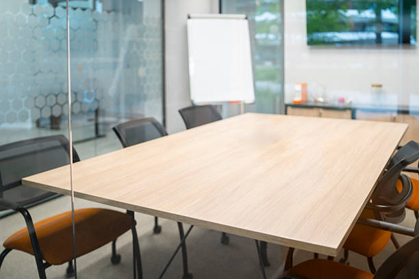 istock Empty meeting room with flip chart and chairs ready for corporate brainstorming 2240196320