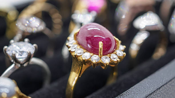 istock Gold jewelry red ruby diamond rings show in luxury retail store display showcase 2240196446