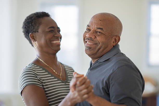 istock Smiling Black Couple Dancing Together In Bright Home Setting, Happiness And Connection 2240196733
