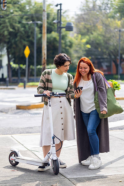 istock Two friends watching her cellphone 2240198454