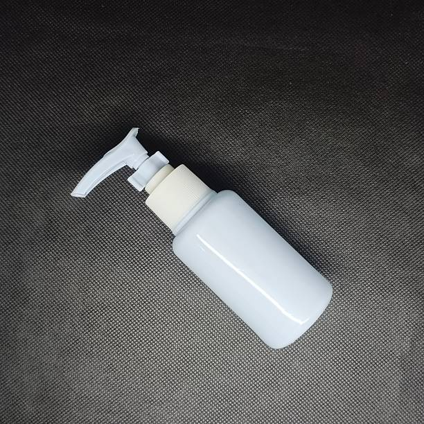 istock Cosmetic product bottle with blank label on black color background 2240199755