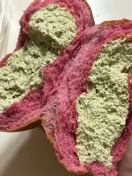 Soft and fluffy cream bread () filled with sweet, silky cream, offering a perfect bite of pillowy texture and rich, creamy indulgence in every delightful mouthful.