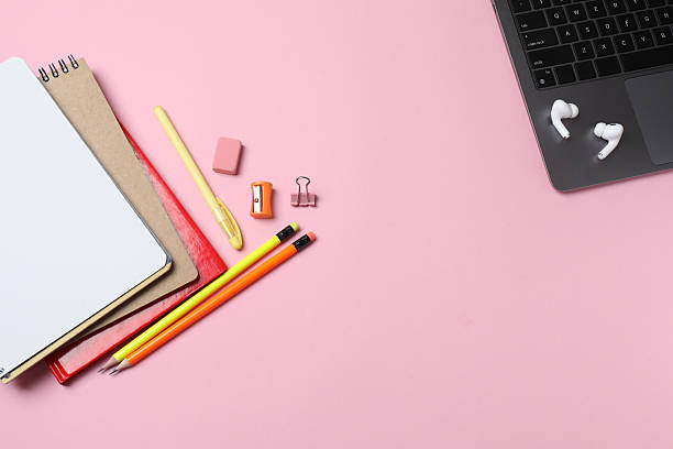 istock School supplies flat lay on pink background with copy space 2240202557