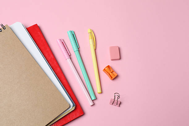 istock School supplies flat lay on pink background with copy space 2240202562
