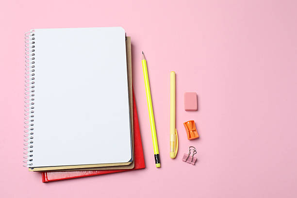 istock School supplies flat lay on pink background with copy space 2240202564