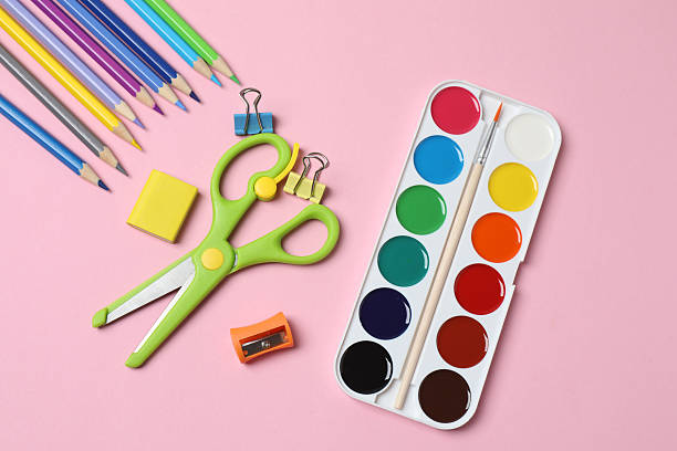 istock School supplies flat lay on pink background with copy space 2240202572