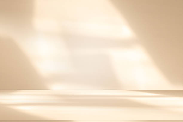 istock Studio style background wall decoration presentation uses white and beige tones. with shadows cast from a nearby window, concept creating a decorative 2240202805