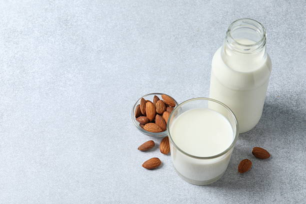 istock glass of milk, bread on the background 2240205032