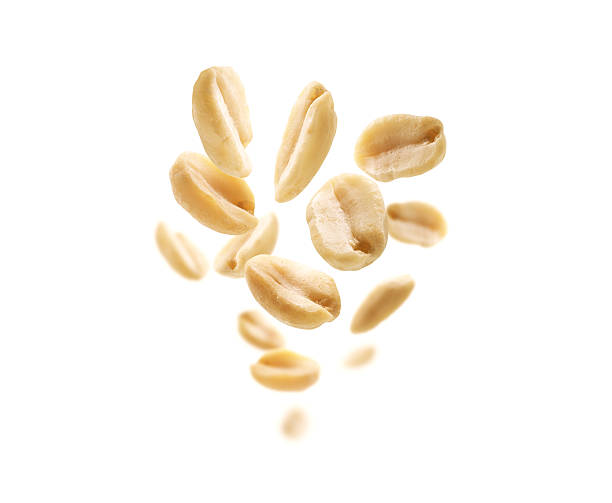 istock Peeled peanuts levitate on a white background 2240206812