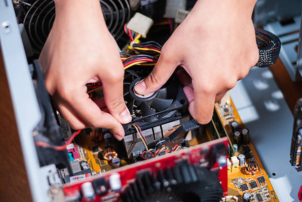 istock Repairing a computer fan home workshop technical guide indoor close-up view diy maintenance tips 2240207227
