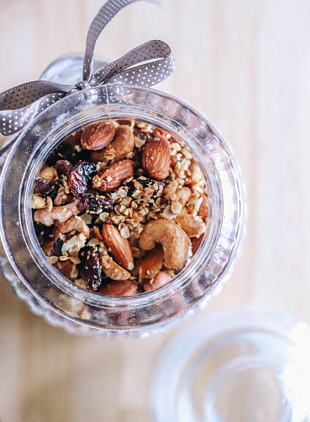 Trail Mix with Nuts and Dried Cranberries in Glass Jar