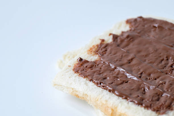 Close-up of white bread with chocolate jam