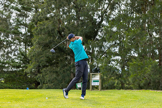istock Asian men teeing off at golf 2240210065