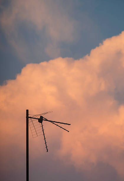 Antenna with a beautiful sunset sky background at dusk