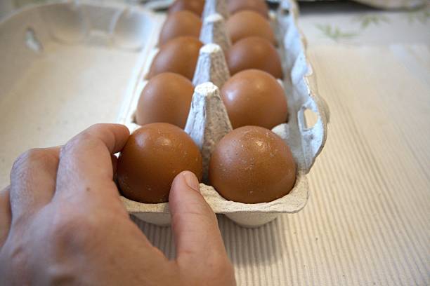 istock Brown chicken eggs in paper box, close-up, copy space 2240213932
