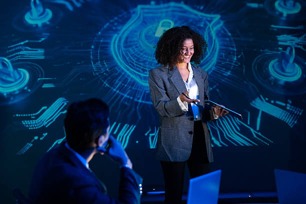 istock Confident female speaker presenting on global technology and cybersecurity at a seminar or conference. 2240219761