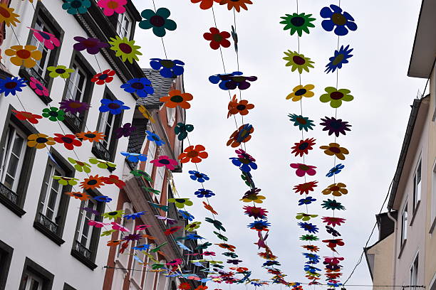 istock colorful flowers above a street 2240221717