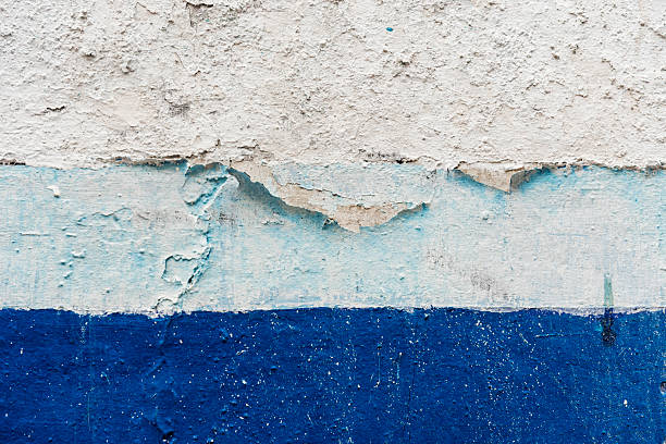 istock Peeling blue and white paint covering a concrete wall. Vector cement texture 2240222241