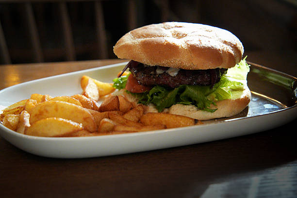 Close-up of a big beef burger with french fries