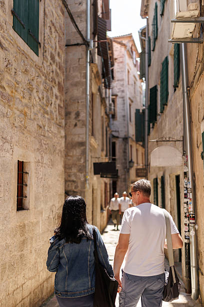 istock Happy mature couple exploring old coastal town during vacation 2240224595