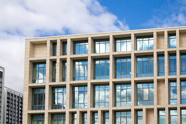 istock Facade of modern office building with square windows. Contemporary urban architecture with glass and concrete. Real photo 2240225752