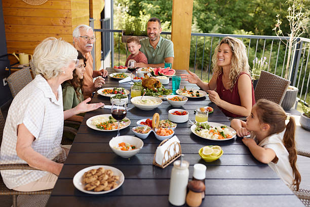istock Extended family's lunch on a patio! 2240226273