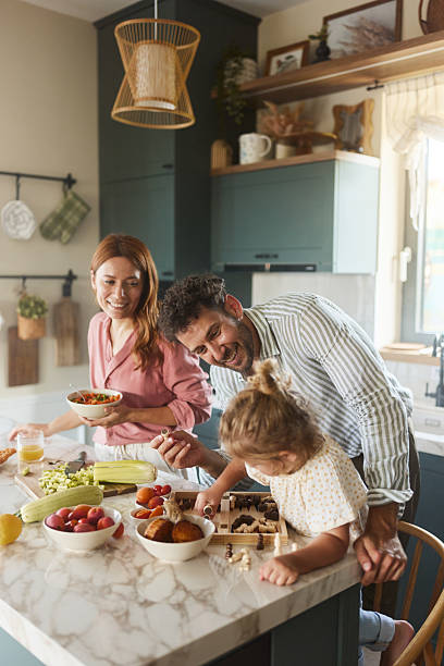 istock Happy family enjoying in the kitchen. 2240226333