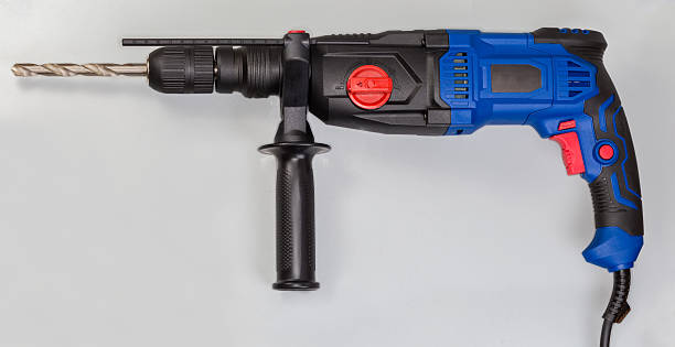 istock Electric rotary hammer with inserted metal drill, side view 2240226344