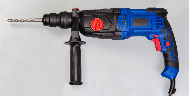 istock Electric rotary hammer with inserted concrete drill bit, side view 2240226395