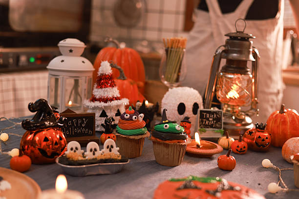istock Halloween background, Halloween decorated by Ghost candle pumpkin and halloween cup cake 2240228540