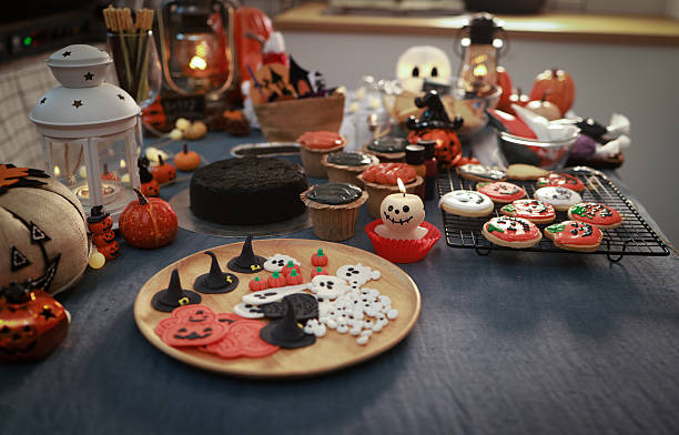 istock Halloween background, Halloween decorated by Ghost candle pumpkin and halloween cup cake 2240228570